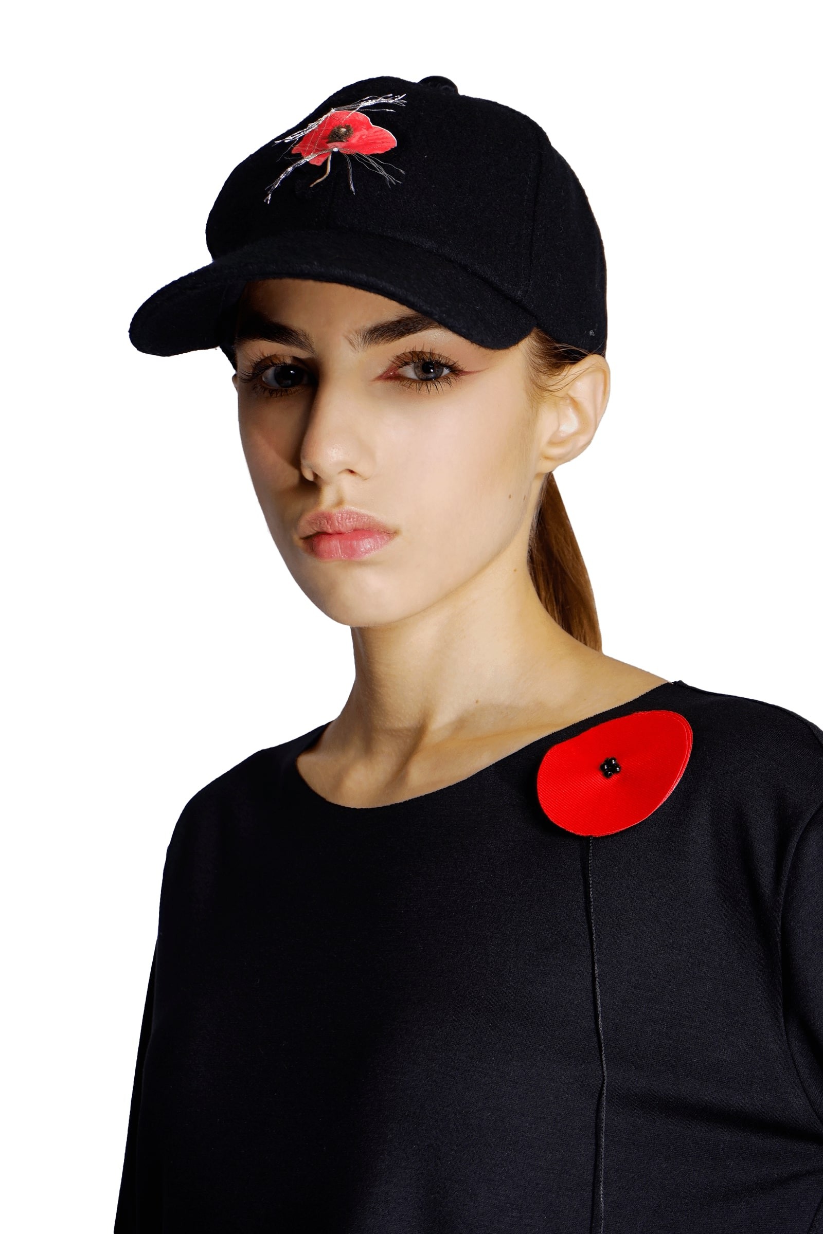 Black cap with poppy